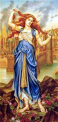 Red-headed woman in greek-style blue dress